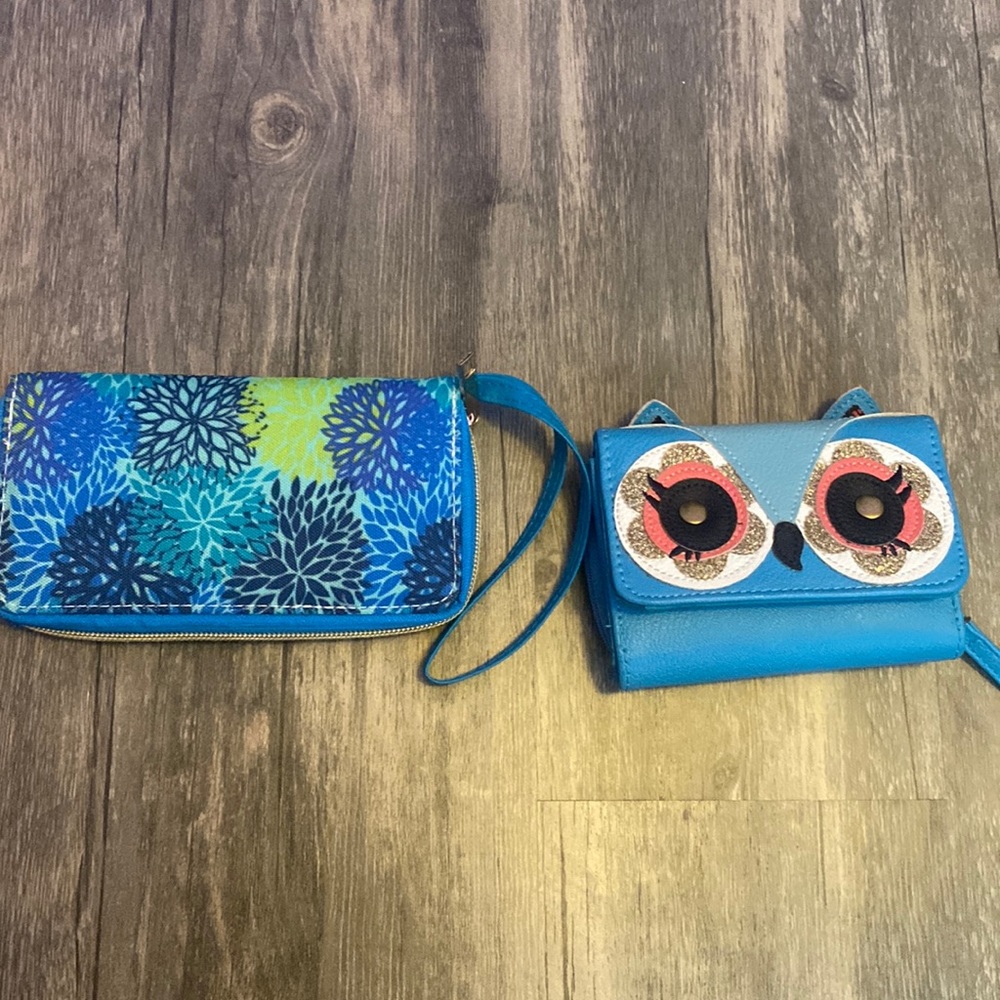 A set. two wallets both blue.